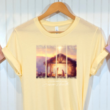 Load image into Gallery viewer, French vanilla  t-shirt with a printed nativity design.