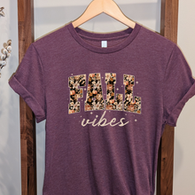 Load image into Gallery viewer, Heather Maroon Bella Canvas t shirt with Fall Vibes floral logo