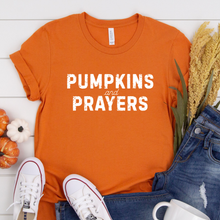 Load image into Gallery viewer, Orange t-shirt with 'Pumpkins and Prayers' text.