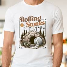 Load image into Gallery viewer, White t-shirt with 'Rolling Stones Since AD 33' graphic design worn by a person indoors.