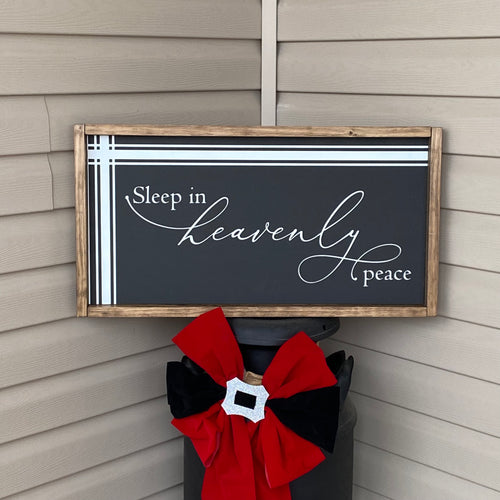 Decorative sign with 'Sleep in heavenly peace' text.
