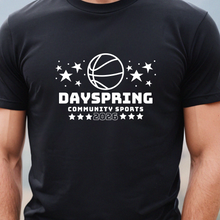 Load image into Gallery viewer, Person wearing a black t-shirt with 'Dayspring Community Sports 2026' print against a mountainous background