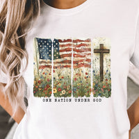 One Nation Under God White Bella Canvas T Shirt. Image has flag, cross, and wildflowers.