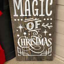 Load image into Gallery viewer, Wooden sign with &#39;Magic of Christmas&#39; text on a wooden surface.