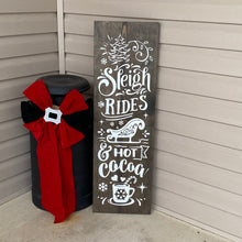 Load image into Gallery viewer, Decorative sign with &#39;Sleigh Rides &amp; Hot Cocoa&#39; text on a dark walnut stained wooden board, leaning against a wall.