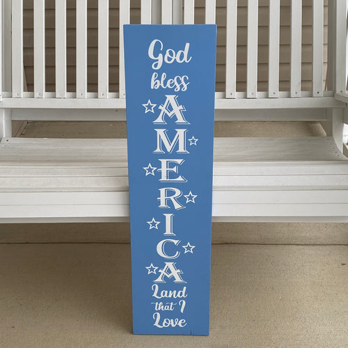 Blue sign with white text 'God Bless America'