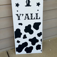 Load image into Gallery viewer, Black-and-white cow print “Hey Y’All” wooden porch leaner.